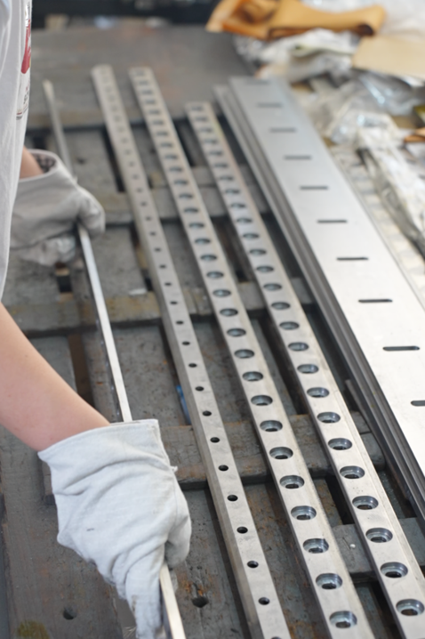 Long perforated cutting blades under factory inspection