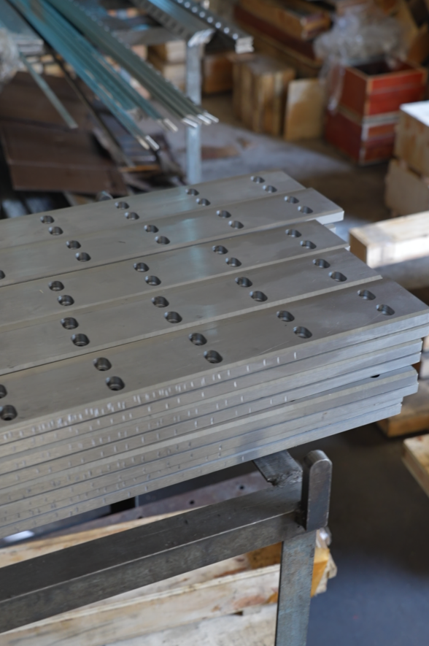 Finished paper and carton cutting blades in the workshop