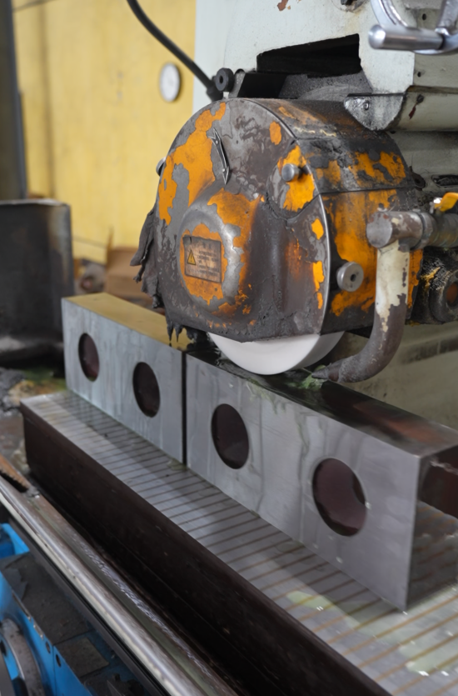 Baitian Blade shear knife being ground in the workshop